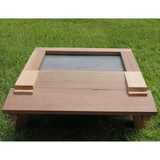 West Country Honey wooden bee hive base with mesh ventilation panel on grass